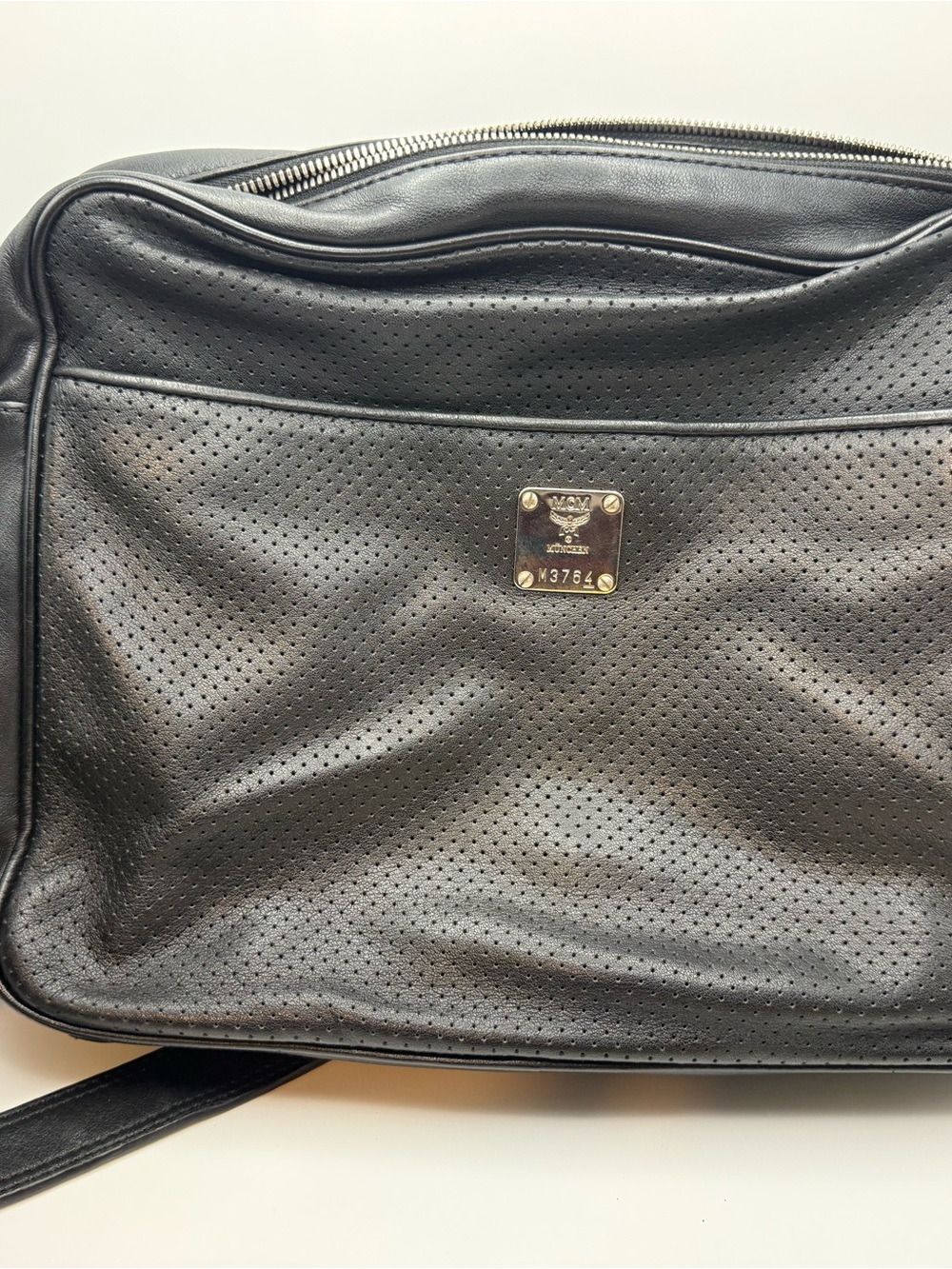 MCM Black Perforated Leather Messenger Bag with Gold Plaque